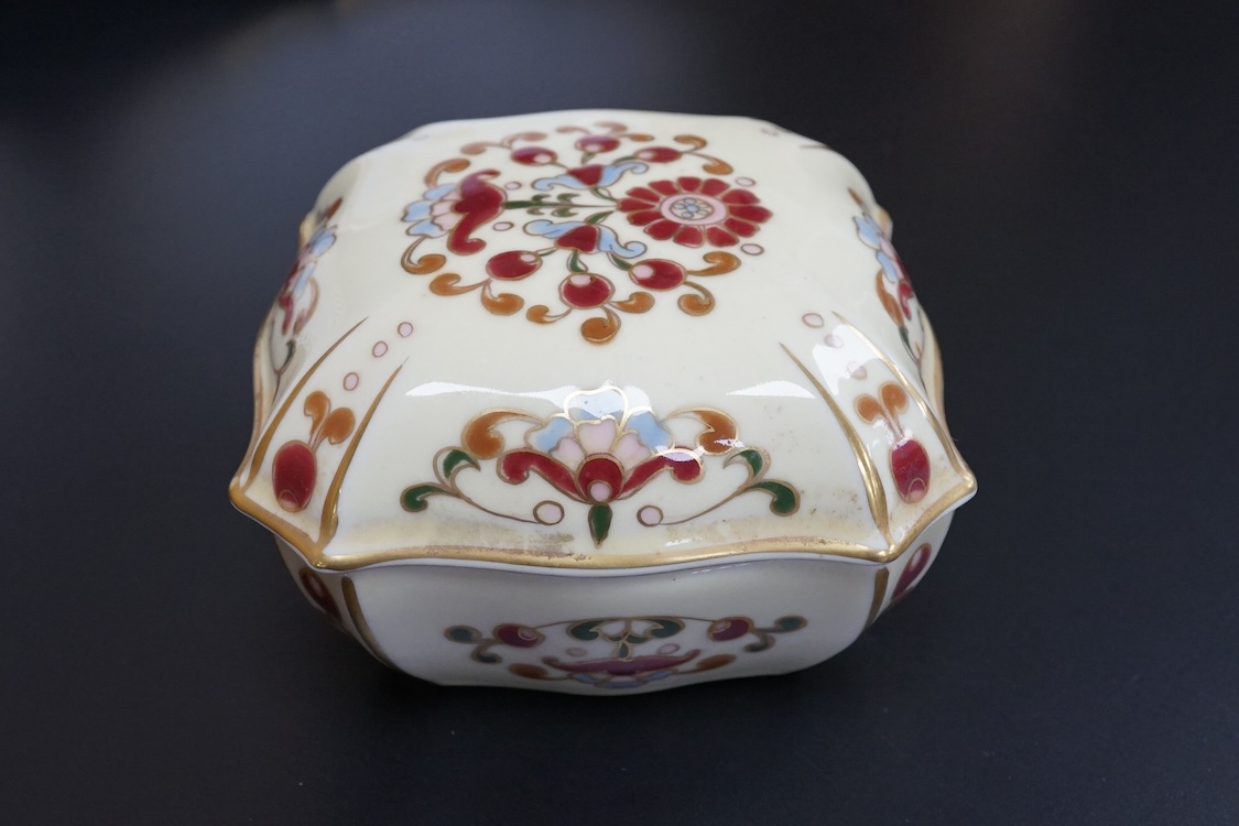 A Meissen plate, a Zsolnay box and cover, and two continental plates, largest 24cm in diameter